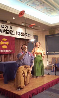 コマ回しの曲芸